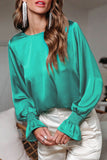 Blouse verte à manches bouffantes en satin